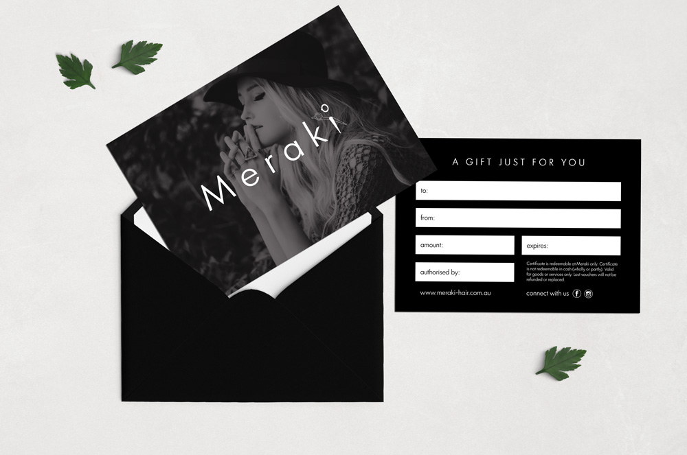 Meraki gift vouchers greyscale photo on the front with female wearing a hat and gift voucher details on the back